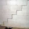 A diagonal stair step crack along the foundation wall of a Gainesville home